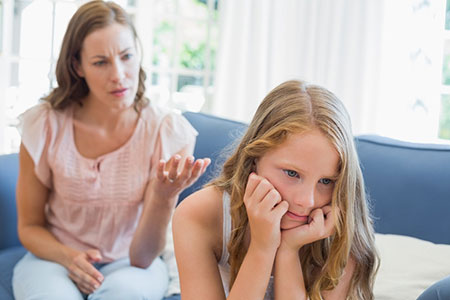 Mother having a conversation with her daughter